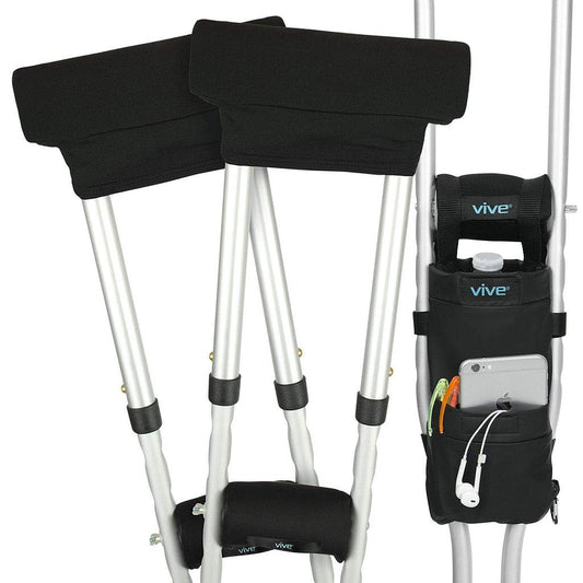 Crutches with black arm pads and a Vive crutch bag on a white background