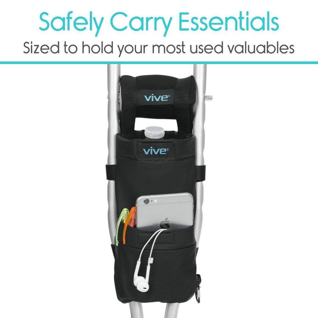 Black travel organizer attached to a suitcase with 'Vive' branding, holding a phone and other items.