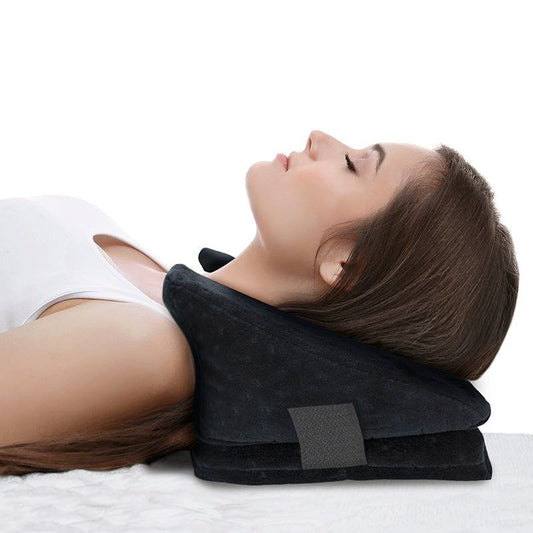 Person using a black neck pillow on a white background