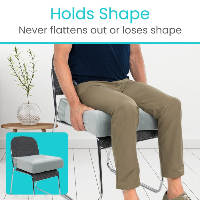 Person sitting on a chair with a cushion, emphasizing the cushion's ability to hold shape.