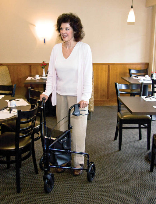 Woman using a walker in a restaurant setting
