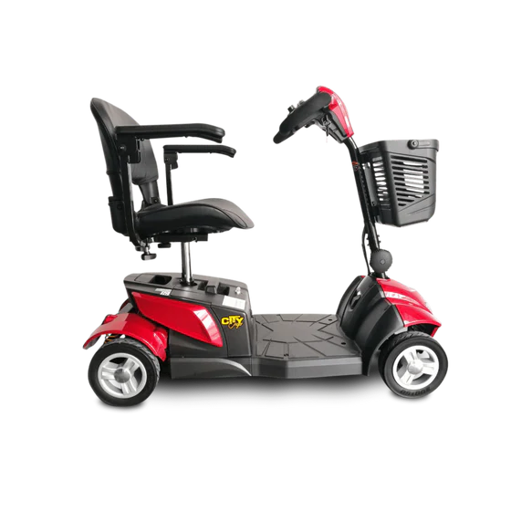 Red and black mobility scooter with a basket on a white background
