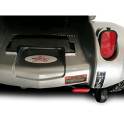 Close-up of a scooter with visible branding and warning labels on a white background