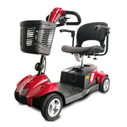 Red and black mobility scooter with a basket on a white background