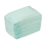 Stack of light blue disposable underpads on a white background