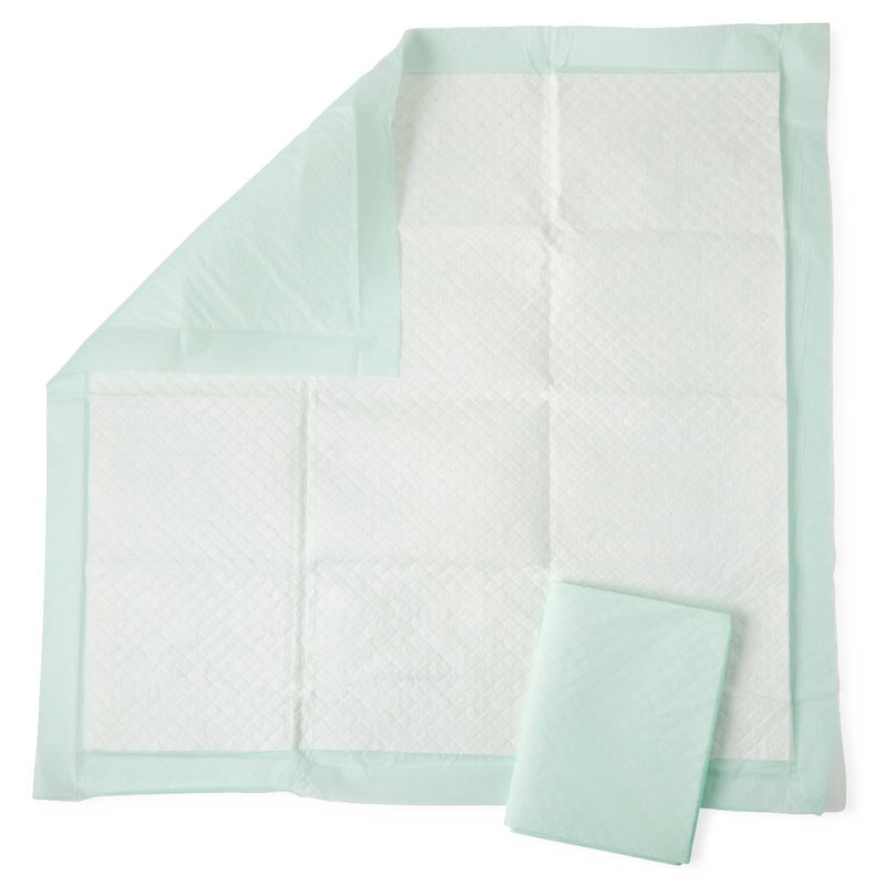 Mint green underpad with a folded corner on a white background