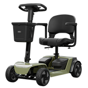 A compact four-wheel electric mobility scooter with a black seat, steering wheel, and basket, featuring an olive green body shell and black wheels, shown on a solid white background.