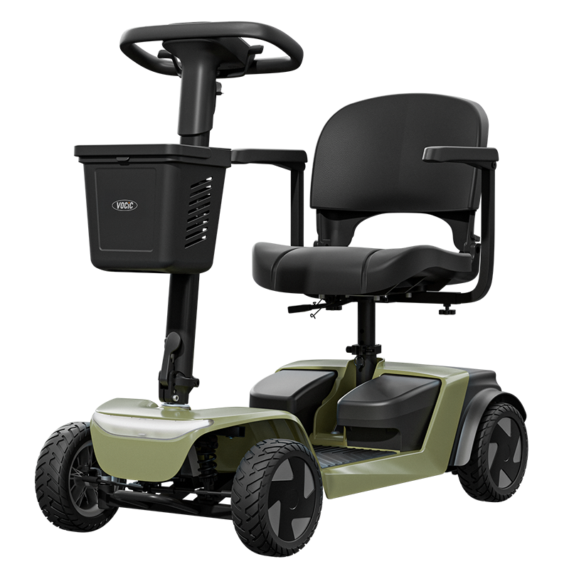 A compact four-wheel electric mobility scooter with a black seat, steering wheel, and basket, featuring an olive green body shell and black wheels, shown on a solid white background.