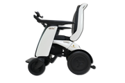 A white and black electric power wheelchair shown from a side profile view against a solid white background.