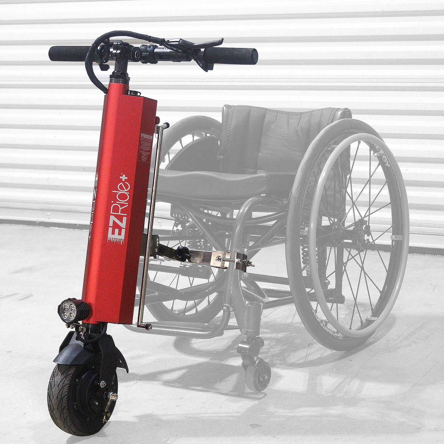 Red EZ Ride scooter attached to a wheelchair on a white background