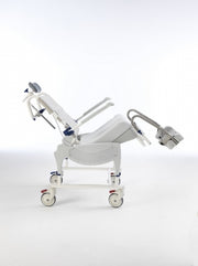 Medical examination table on wheels with a white background