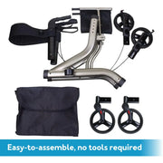 A folding wheelchair or mobility chair set shown on a white background with a blue text banner at the bottom reading 'Easy-to-assemble, no tools required.' The set includes a silver metal frame, black seat and armrest straps, two black hand wheels, two small black foot pedals, and a black carrying bag.