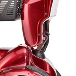 Close-up of a red scooter with a focus on the front wheel and fender.