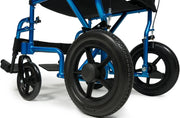 Close-up of a blue and black manual wheelchair with large black wheels, shown on a white studio background.