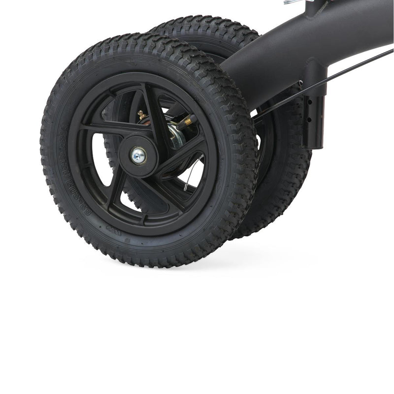 Close-up of a black wheel with tread pattern on a white background