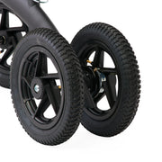 Close-up of black wheels on a vehicle with a white background