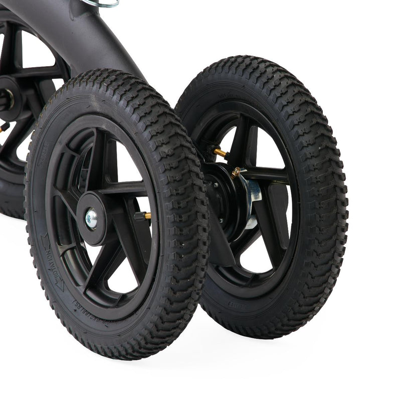 Close-up of black wheels on a vehicle with a white background