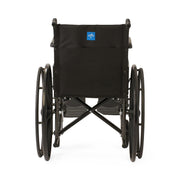Rear view of a black manual wheelchair with a black fabric backrest and a small blue logo patch on the backrest, photographed on a clean white background.
