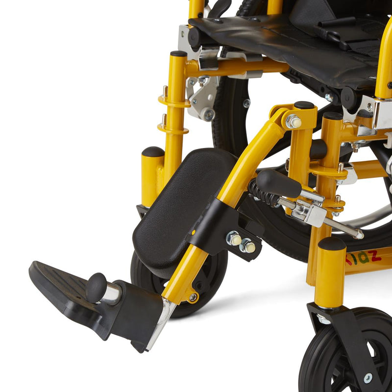 Close-up of a wheelchair frame and leg rest in bright yellow and black, showing the footrest, armrest support, and part of the wheel assembly on a white background.