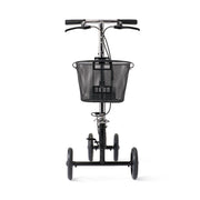 A black three-wheeled compact tricycle with a front wire basket, black handlebars, and black wheels, photographed against a solid white background.