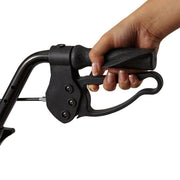 Hand holding a black metal tool on a white background