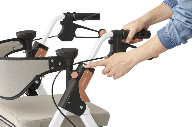 Close-up of a person adjusting controls on a rollator with a white background