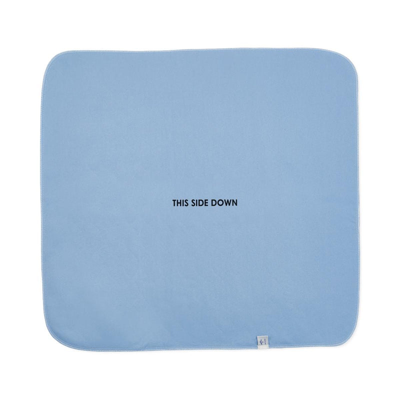 Light blue pad with 'THIS SIDE DOWN' text on a white background