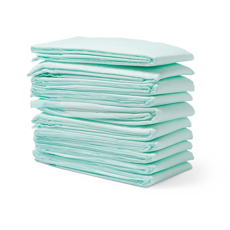 Stack of light blue disposable underpads on a white background