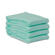 A stack of four folded light mint green absorbent pads on a clean white background.