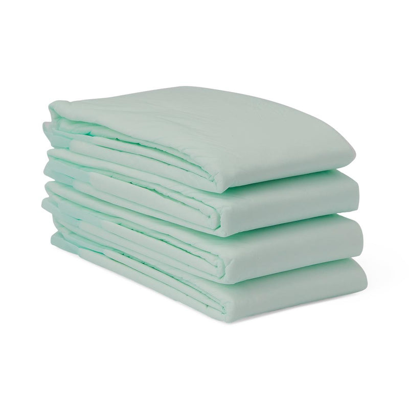 Stack of light green underpads on a white background