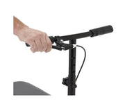 Hand holding a black scooter handlebar with a white background