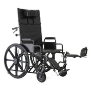 A black manual wheelchair with a high backrest, padded seat, extended footrest, and large spoked rear wheels, photographed on a plain white background.