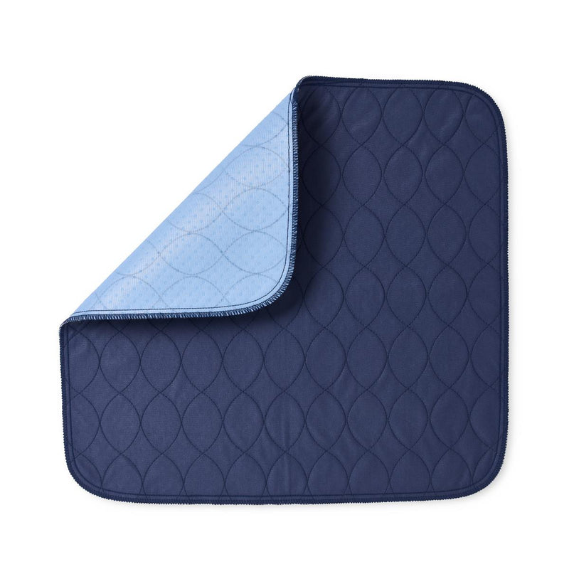 A navy blue quilted underpad with a light blue reverse side, shown on a plain white background.