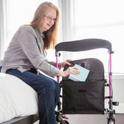woman putting items in her rollator bag