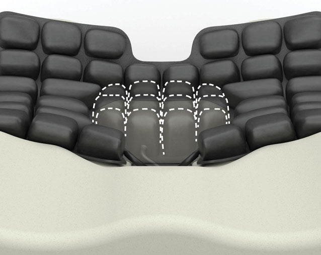 Black massage cushion with massage points indicated on a white background