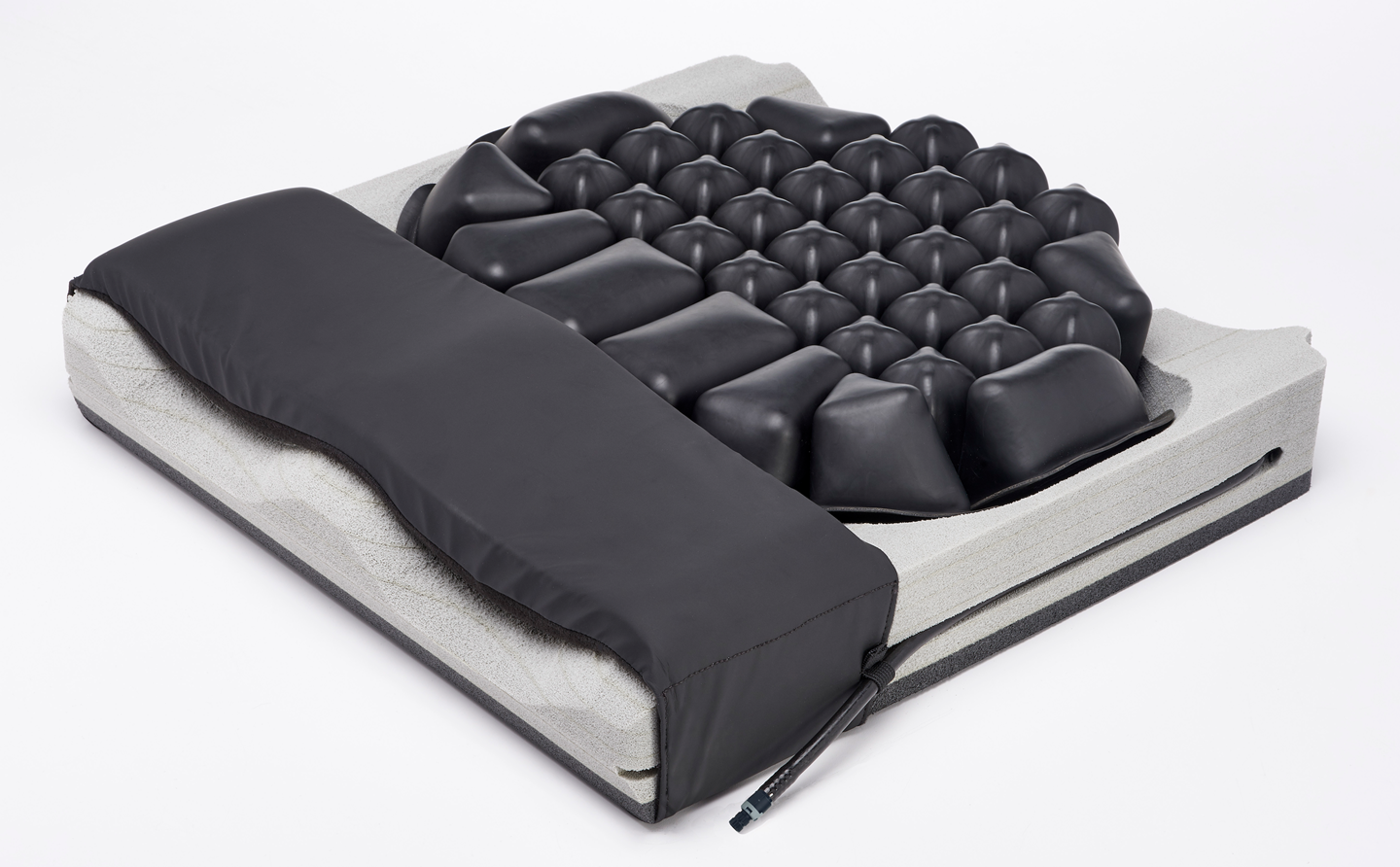 Massage mattress with black textured surface on a white background