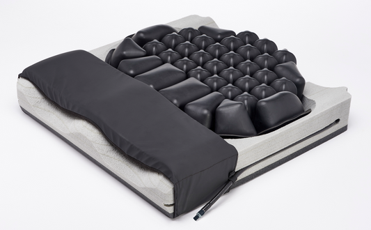 Massage mattress with black textured surface on a white background