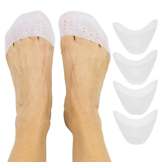 White silicone shoe inserts on a person's feet with additional inserts displayed above.