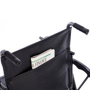 Wheelchair with a pocket holding a newspaper titled 'Finance'