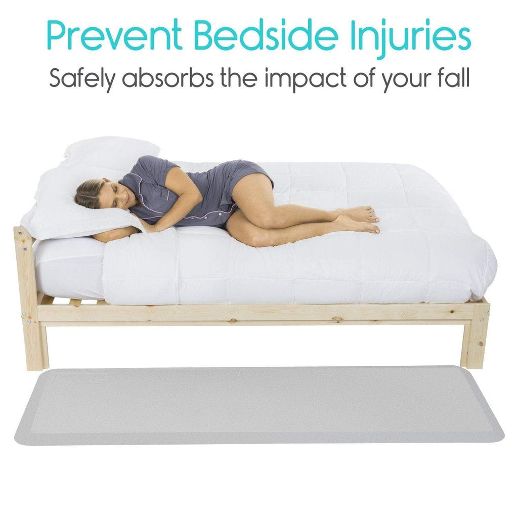 Woman lying on a bed with a mattress pad, text 'Prevent Bedside Injuries' and 'Safely absorbs the impact of your fall'.