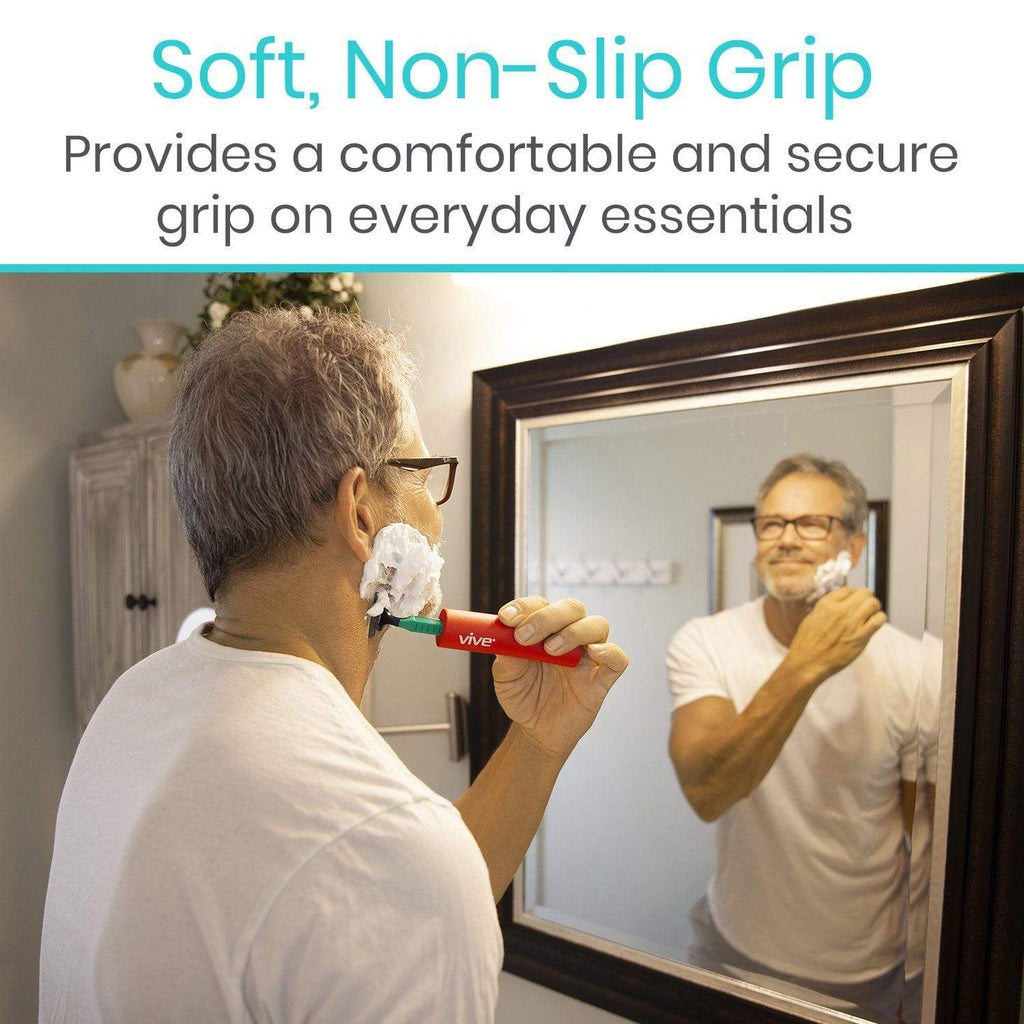 Person shaving with a razor, standing in front of a mirror, with text about soft, non-slip grip.