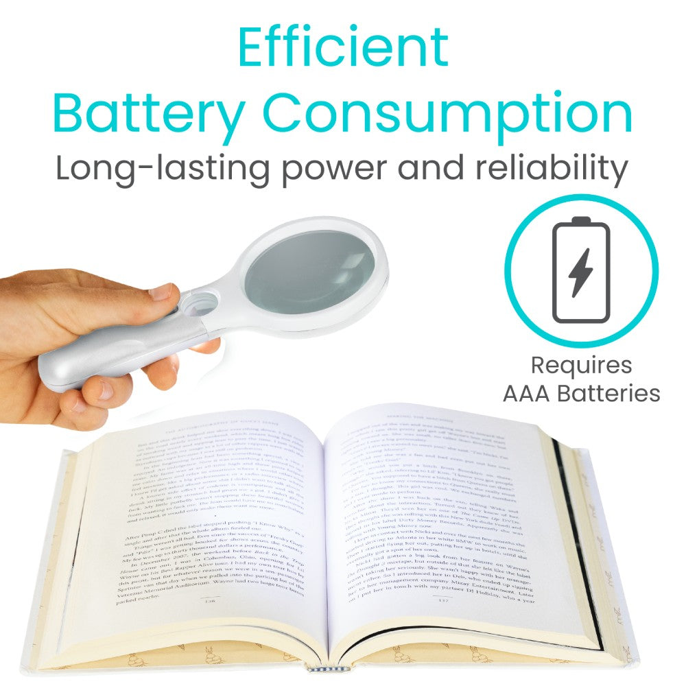 Handheld magnifying glass illuminating an open book with text about battery consumption.