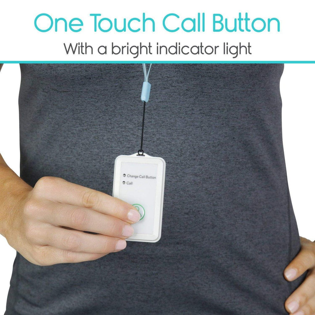 One touch call button with a bright indicator light held by a person wearing a dark shirt.