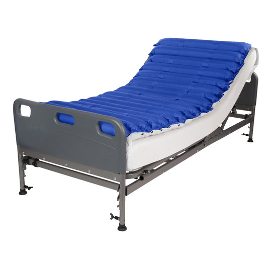 Hospital bed with blue air mattress on a white background