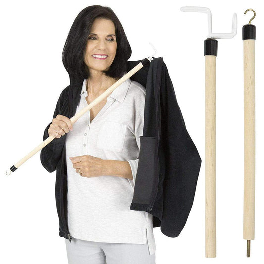 Woman holding a coat with a wooden rod and a black jacket, with additional rods on a white background.