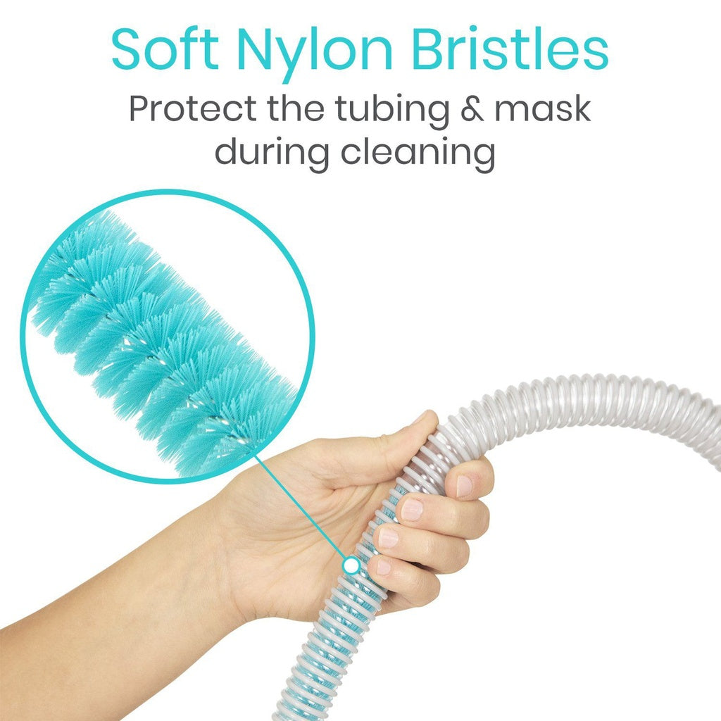 Hand holding a clear hose with soft nylon bristles and text about protecting tubing and mask during cleaning.