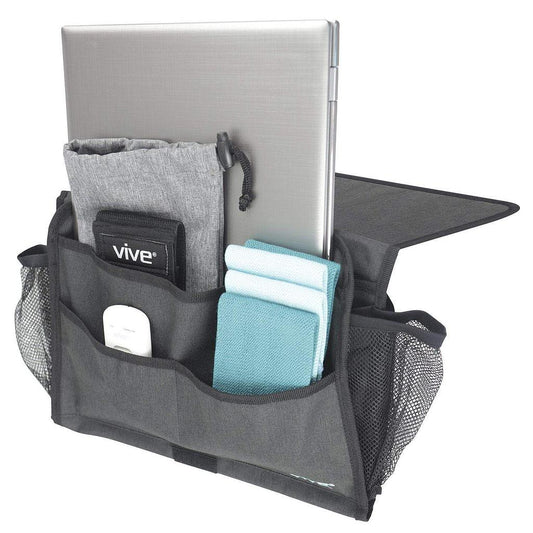 Laptop in a black organizer with various items on a white background