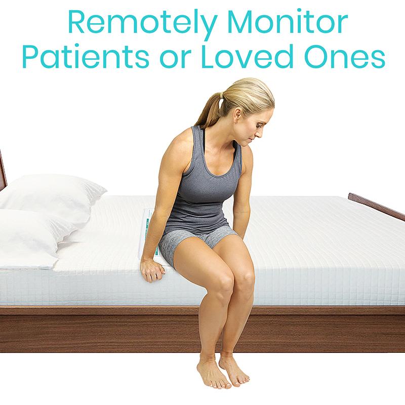 Woman sitting on a bed with text 'Remotely Monitor Patients or Loved Ones' above her.