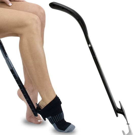 Person using a black foot care device on a white background