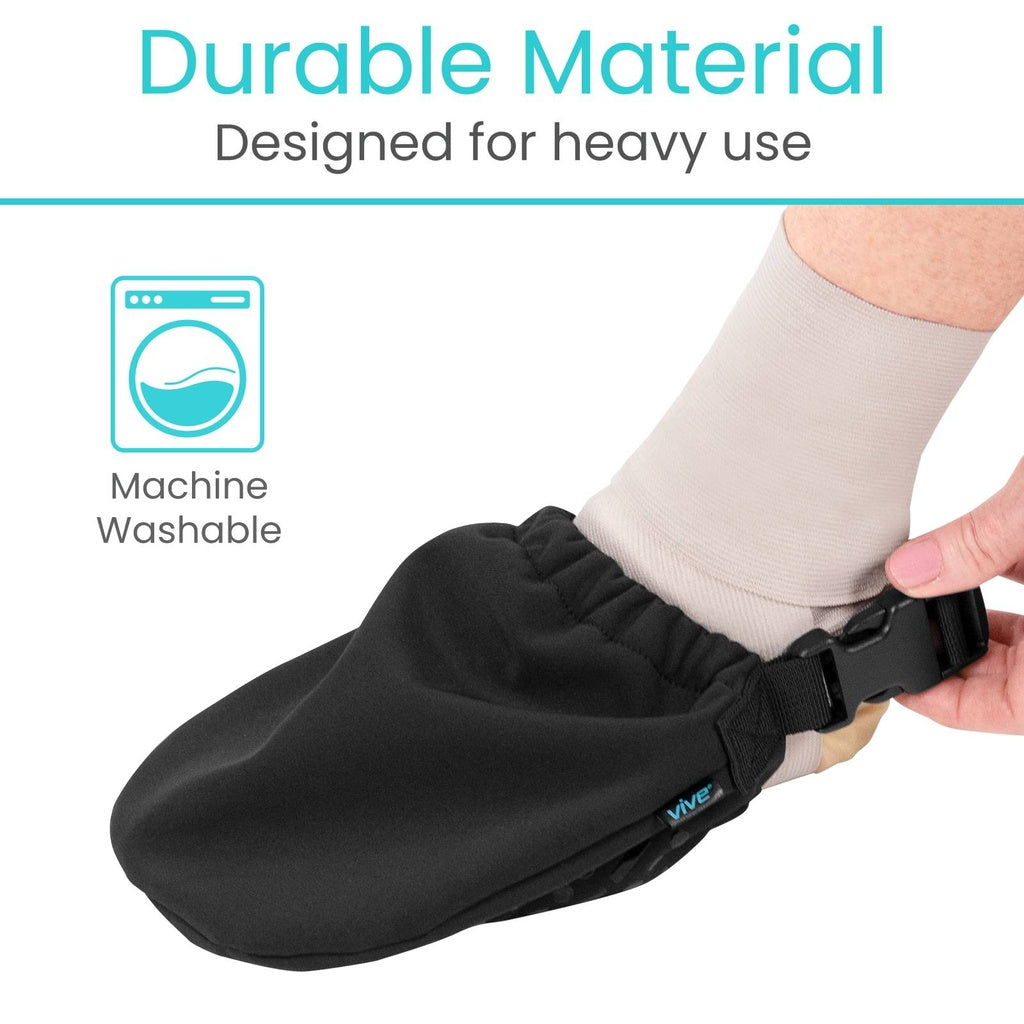 Black foot cover with a person wearing it, labeled as durable material designed for heavy use and machine washable.